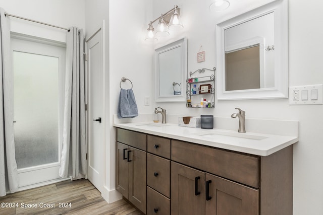 bathroom featuring vanity, hardwood / wood-style floors, and shower / bath combo