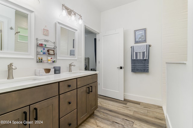 bathroom with vanity and wood-type flooring