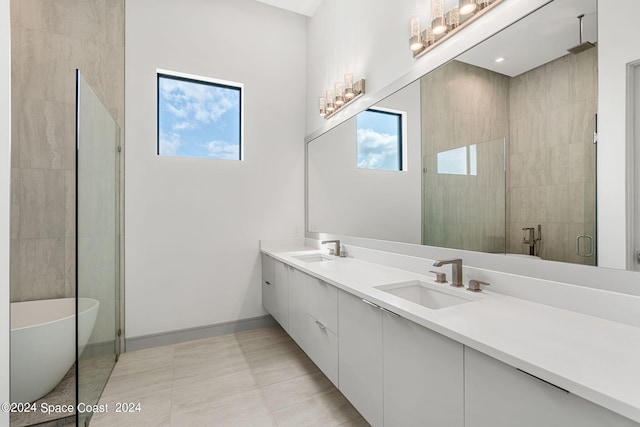 bathroom with vanity, plus walk in shower, and tile patterned floors