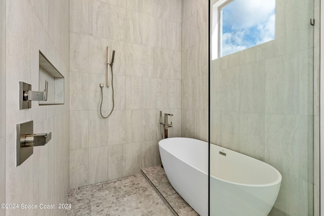 bathroom with separate shower and tub