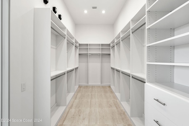 walk in closet featuring light wood-type flooring