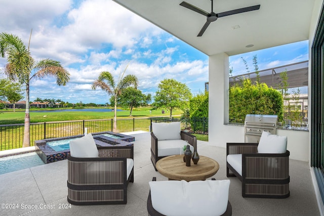 view of patio / terrace featuring a fenced in pool, exterior kitchen, an outdoor hangout area, area for grilling, and ceiling fan