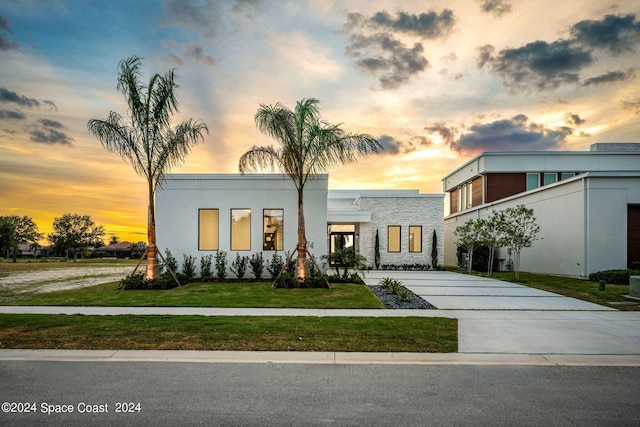 contemporary house with a lawn