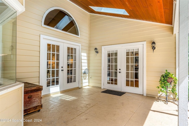 property entrance with a patio and french doors