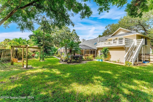 1150 Old Parsonage Dr, Merritt Island, FL 32952 - view of yard with fence, stairway, a lanai, and a wooden deck