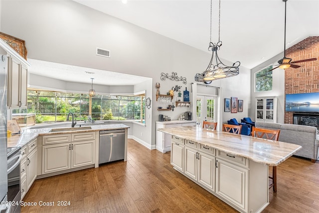 1150 Old Parsonage Dr, Merritt Island, FL 32952 - kitchen featuring visible vents, stainless steel appliances, high vaulted ceiling, and a sink