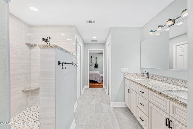 1150 Old Parsonage Dr, Merritt Island, FL 32952 - bathroom with baseboards, visible vents, walk in shower, and a sink