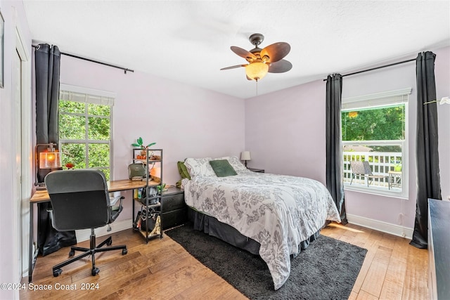 bedroom featuring light hardwood / wood-style floors and ceiling fan