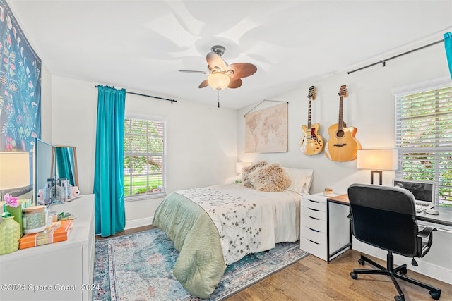1150 Old Parsonage Dr, Merritt Island, FL 32952 - bedroom featuring ceiling fan, wood finished floors, and baseboards