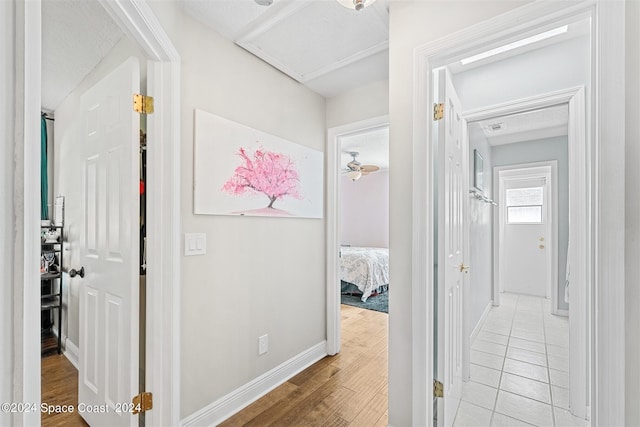 hallway with light hardwood / wood-style flooring