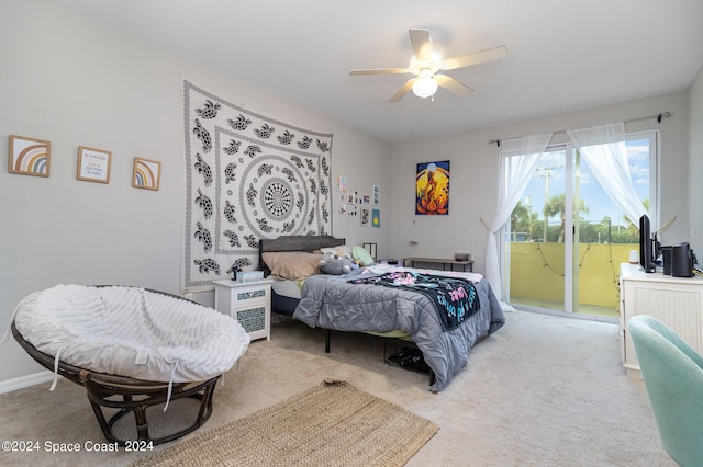 bedroom with access to outside, carpet floors, and a ceiling fan