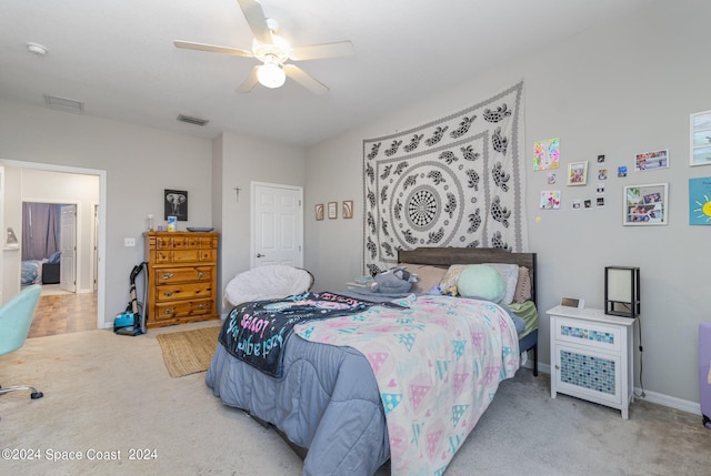 bedroom with a ceiling fan, carpet, visible vents, and baseboards