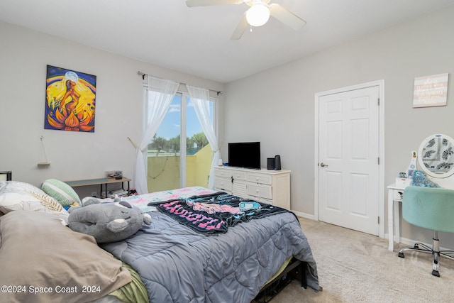 bedroom featuring light carpet, a ceiling fan, and baseboards