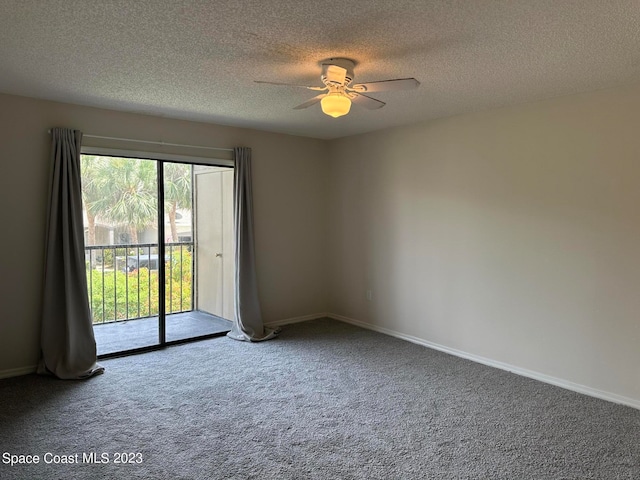 carpeted empty room featuring a textured ceiling, plenty of natural light, and ceiling fan