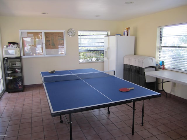 game room featuring dark tile patterned floors