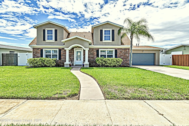 view of front of property with a garage and a front lawn