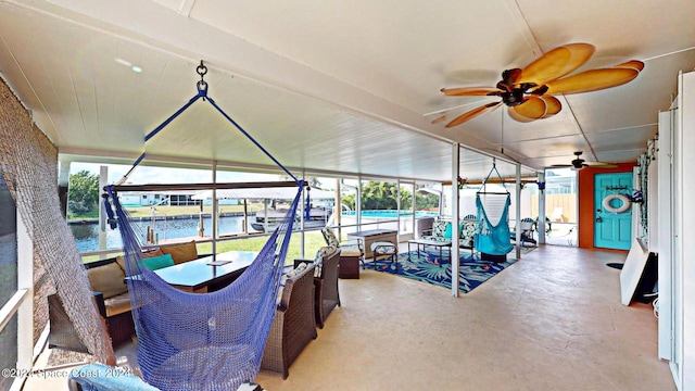 exterior space featuring a water view and ceiling fan