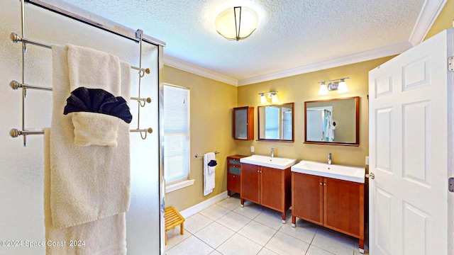 bathroom featuring tile patterned floors, crown molding, a textured ceiling, and vanity