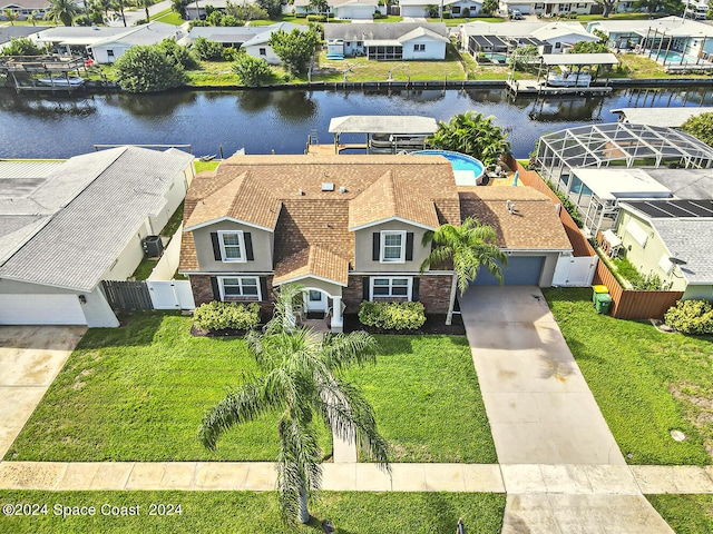 birds eye view of property with a water view