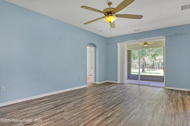 empty room with ceiling fan and hardwood / wood-style floors