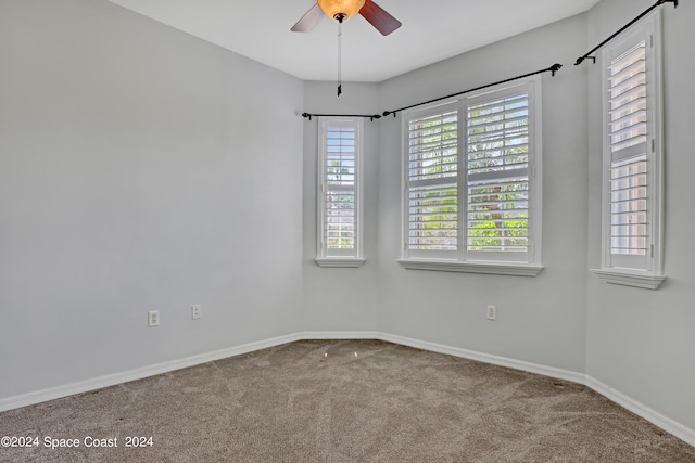 carpeted empty room with ceiling fan