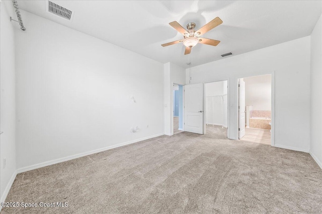 673 Remington Green Dr SE, Palm Bay, FL 32909 - unfurnished bedroom with a spacious closet, carpet, and visible vents