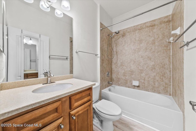 673 Remington Green Dr SE, Palm Bay, FL 32909 - full bathroom featuring toilet, shower / bathing tub combination, and vanity
