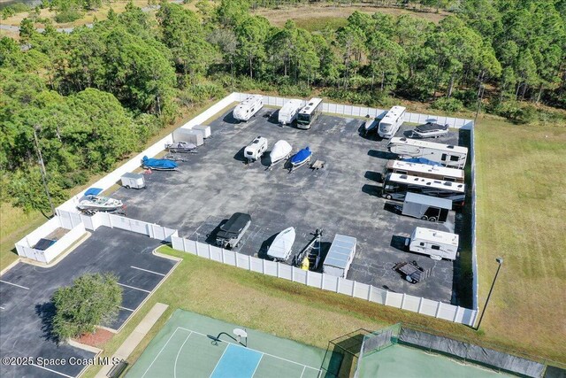 673 Remington Green Dr SE, Palm Bay, FL 32909 - drone / aerial view featuring a wooded view