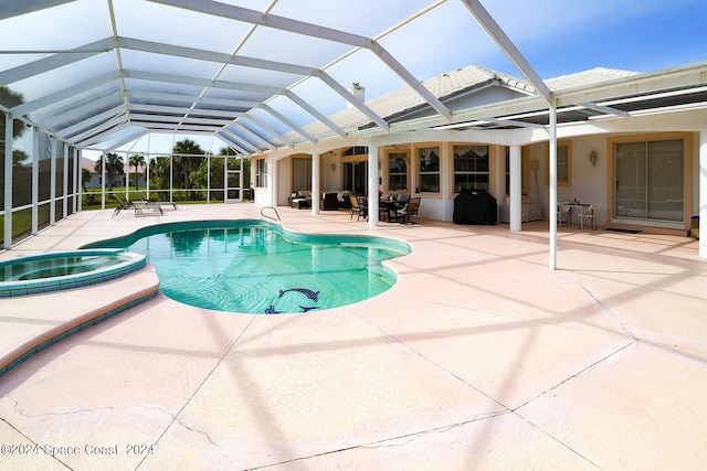 view of swimming pool with a lanai and a patio