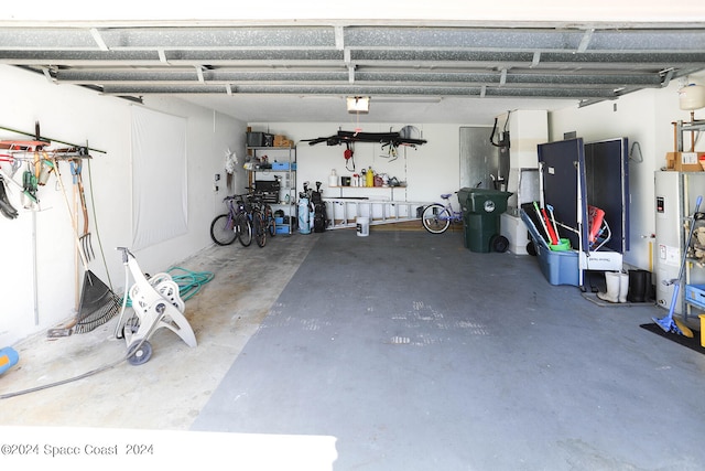 garage featuring gas water heater and a garage door opener