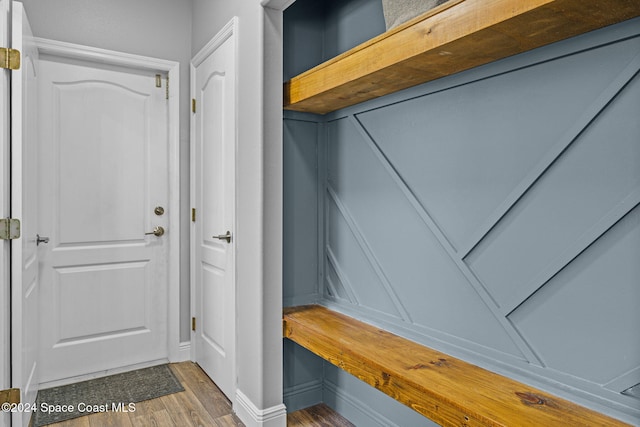 mudroom with dark hardwood / wood-style floors