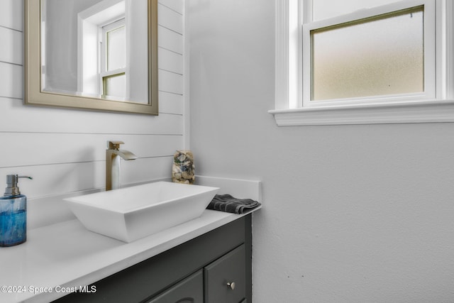 bathroom featuring a wealth of natural light and vanity