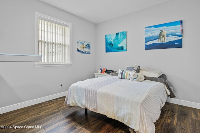 bedroom featuring dark hardwood / wood-style floors