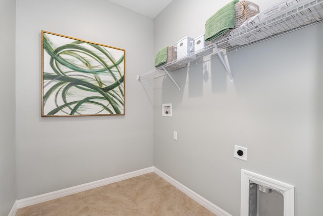 laundry area with light tile patterned floors, hookup for a washing machine, and hookup for an electric dryer