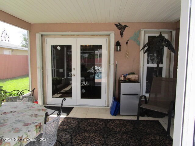 doorway to property with french doors