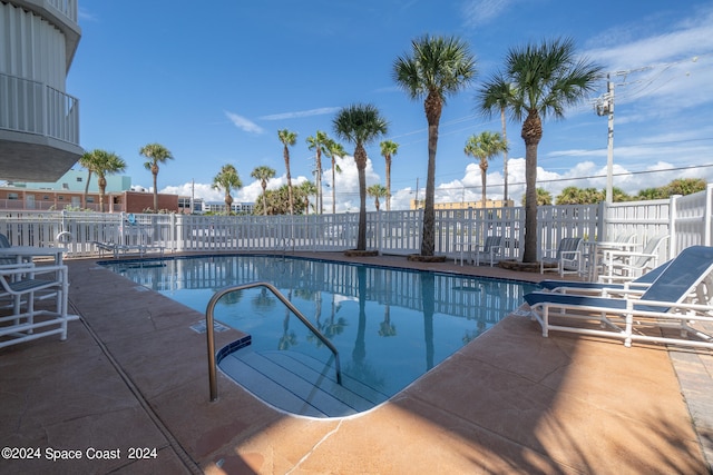 view of swimming pool featuring a patio