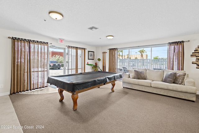 playroom with billiards and a textured ceiling