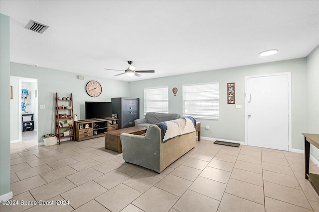 living room with light tile patterned flooring and ceiling fan