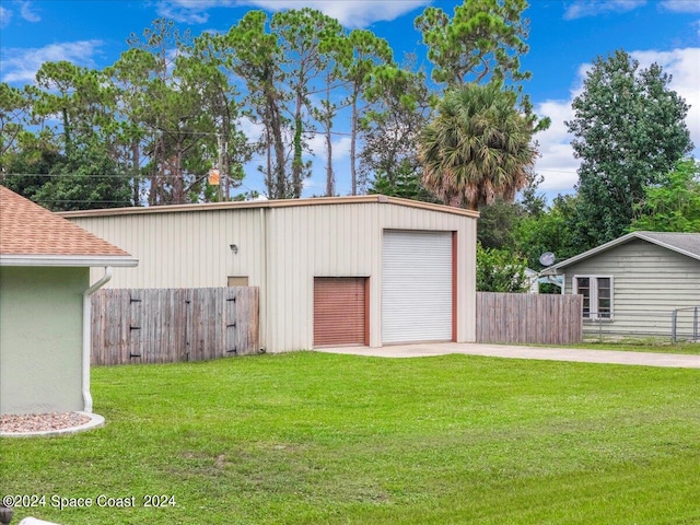 garage featuring a yard