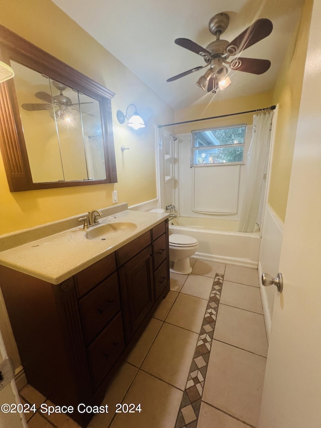 full bathroom with ceiling fan, tile patterned flooring, toilet, vanity, and shower / bath combination with curtain