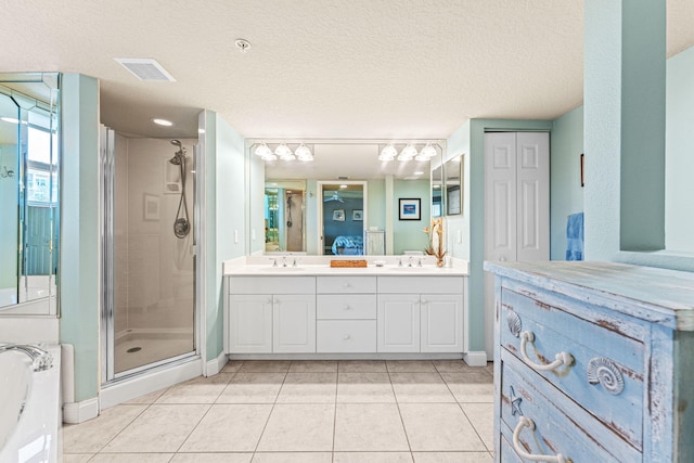 ensuite bathroom with double vanity, a sink, connected bathroom, and a shower stall