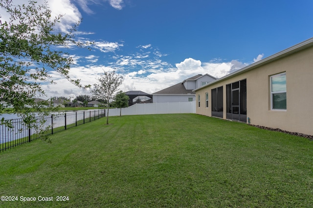 view of yard with a sunroom