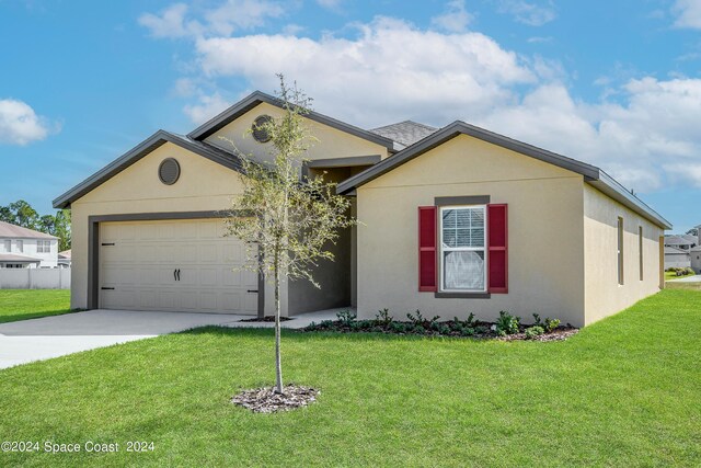 ranch-style home with a garage and a front yard