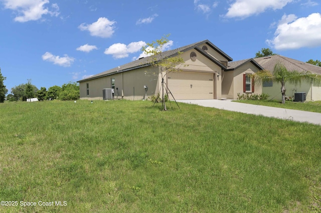 2120 Garbett Ave SW, Palm Bay, FL 32908 - ranch-style house featuring central AC unit, driveway, an attached garage, and stucco siding