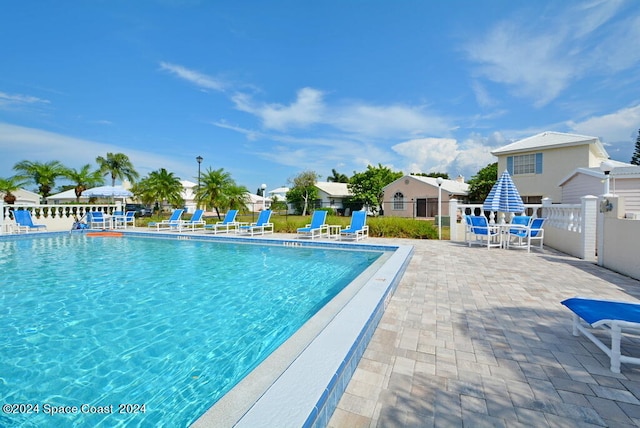 view of swimming pool with a patio area