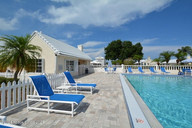 view of pool featuring a patio area