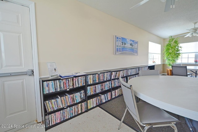 office with ceiling fan and a textured ceiling