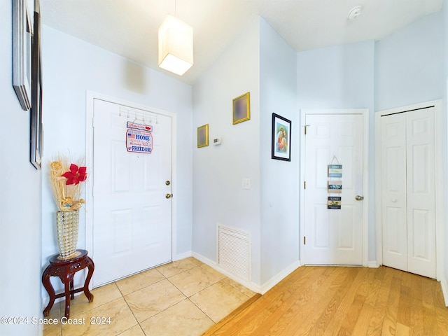 foyer with light hardwood / wood-style floors