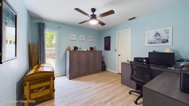 office with ceiling fan and light wood-type flooring