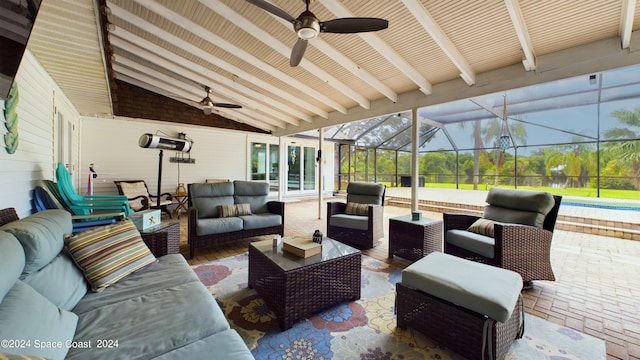 view of patio / terrace featuring a lanai, outdoor lounge area, and ceiling fan